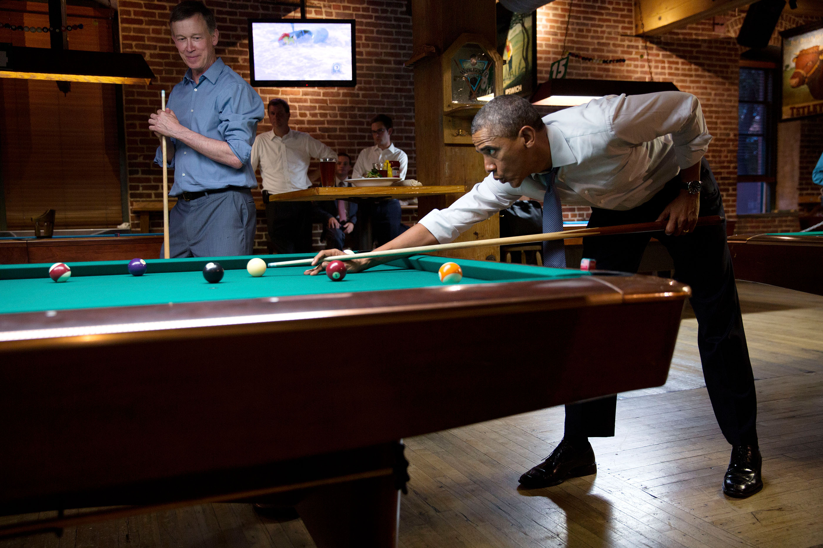 Colorado, July 8, 2014. Playing pool with Gov. John Hickenlooper in Denver. (Official White House Photo by Pete Souza)