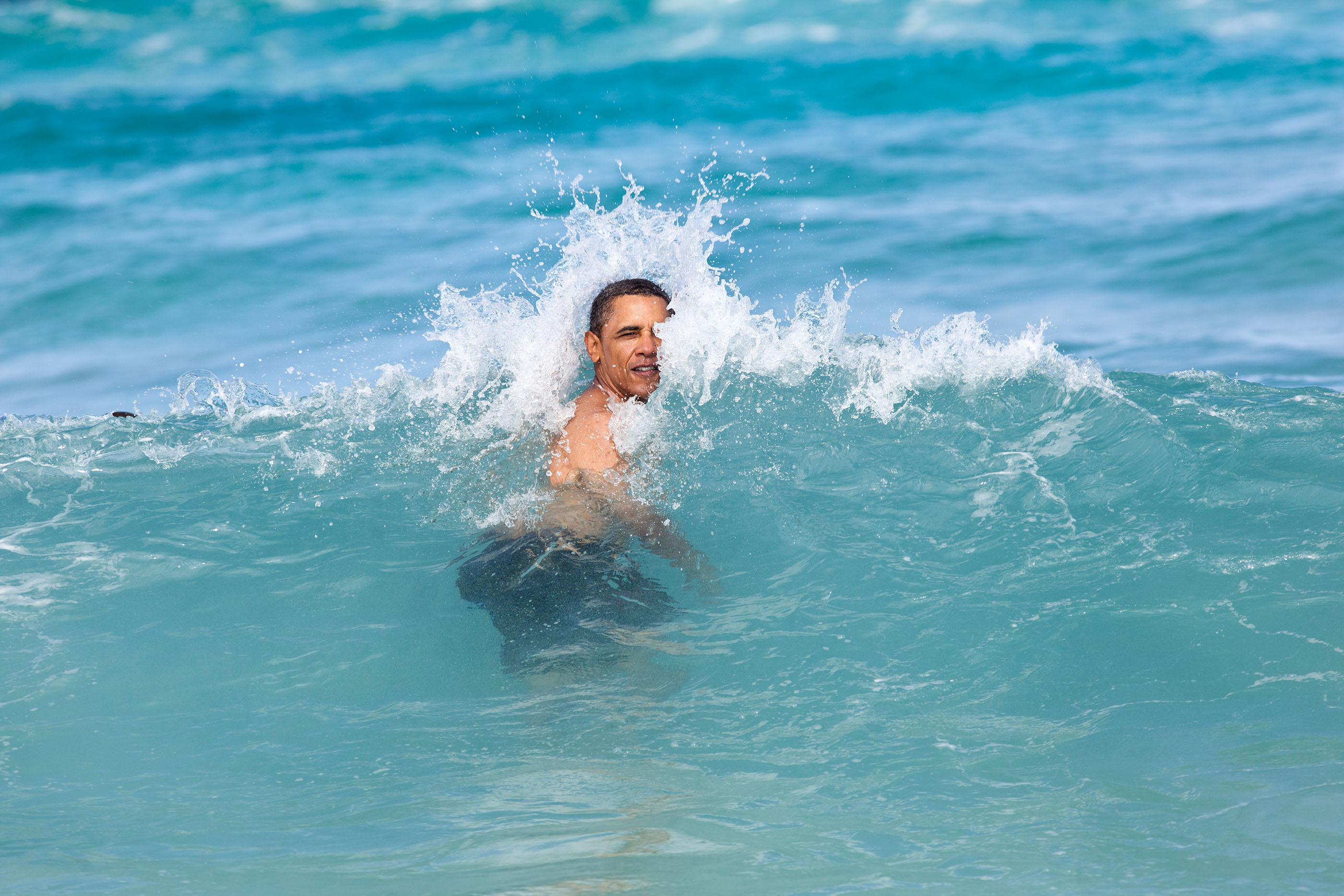 Hawaii, Jan. 1, 2012. Swimming at Pyramid Rock Beach in Kaneohe Bay. (Official White House Photo by Pete Souza)
