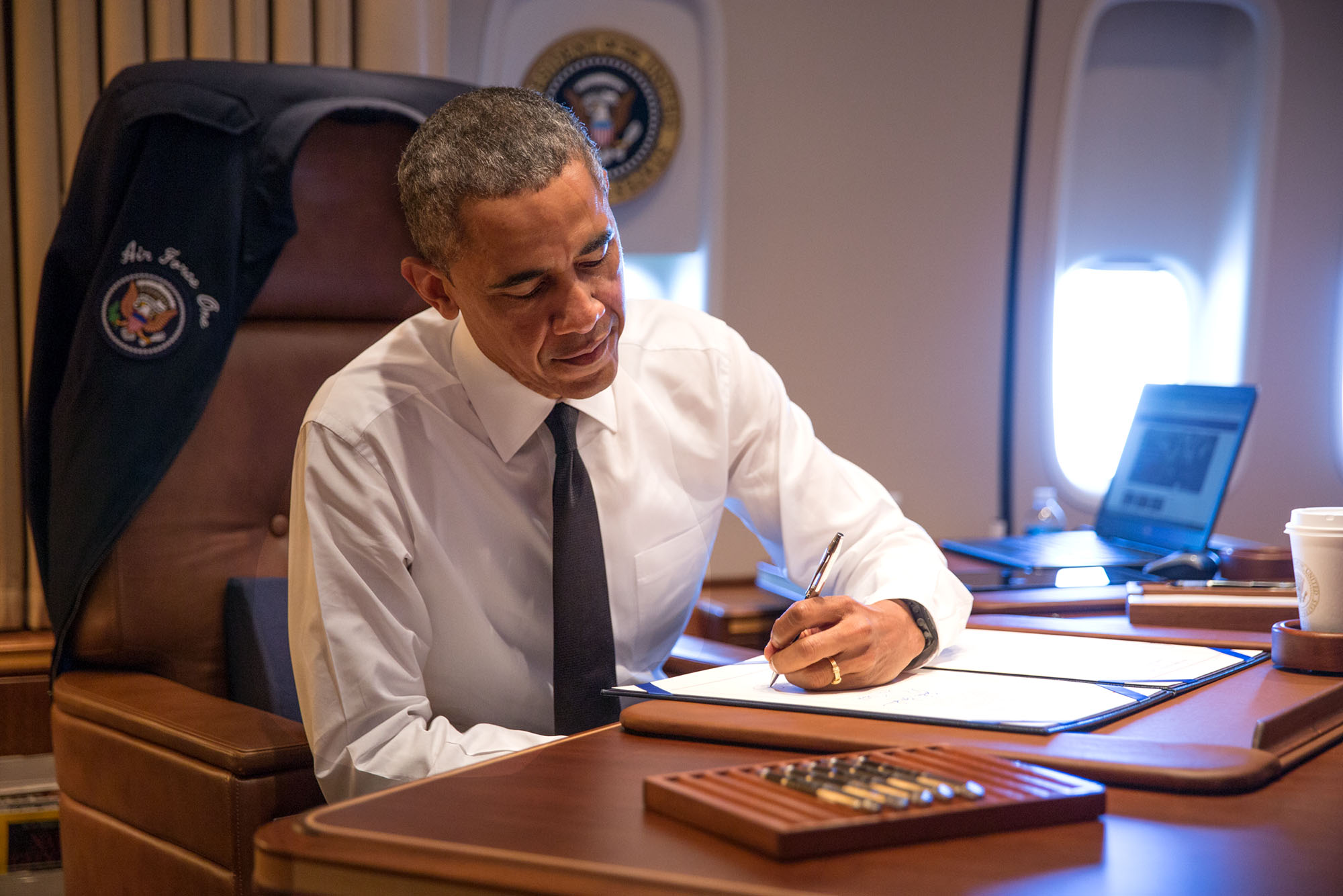 Aboard Air Force One en route to Alabama, President Obama signs H.R. 432 authorizing the Congressional Gold Medal to the 