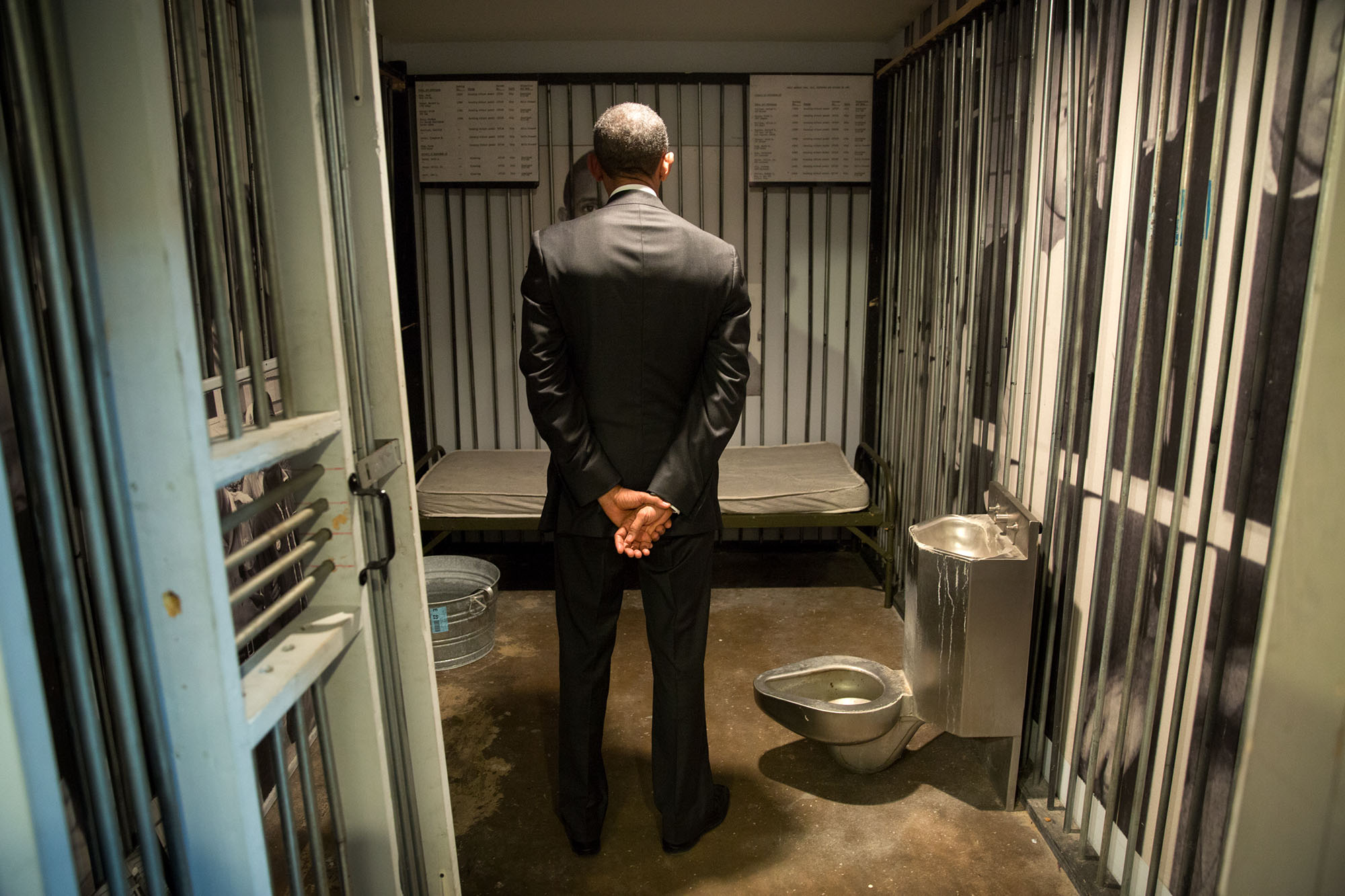 The President stands inside a replica prison cell at the museum. (Official White House Photo by Pete Souza)