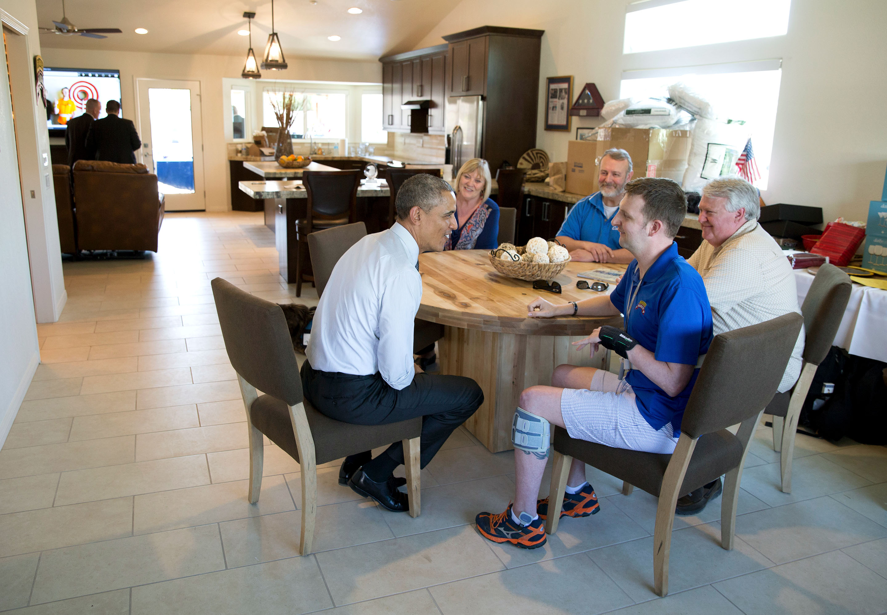 March 13, 2015: President Obama visits with Cory and his family at the kitchen table. (Official White House Photo by Pete Souza)