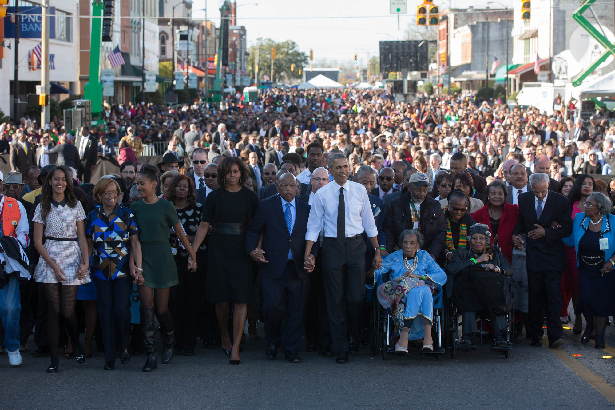 The First Family waits with former President George W. Bush, former First Lady Laura Bush prior to the walking across the Edmund Pettus Bridge