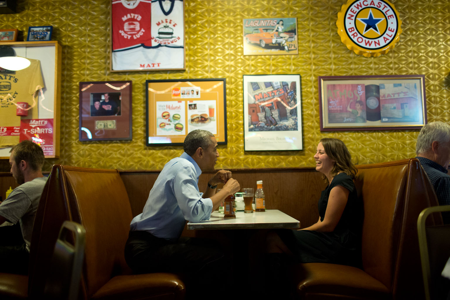 President Barack Obama has lunch with Rebekah Erler at Matt's Bar in Minneapolis, Minn., June 26, 2014. Erler is a 36-year-old working wife and mother of two pre-school aged boys who had written the President a letter about economic difficulties. 