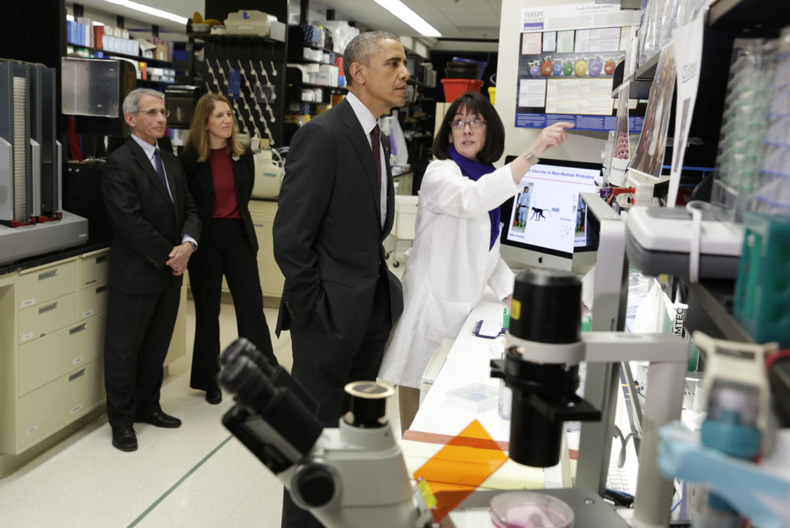 President Obama tours a lab at the Vaccine Research Center at the National Institutes of Health