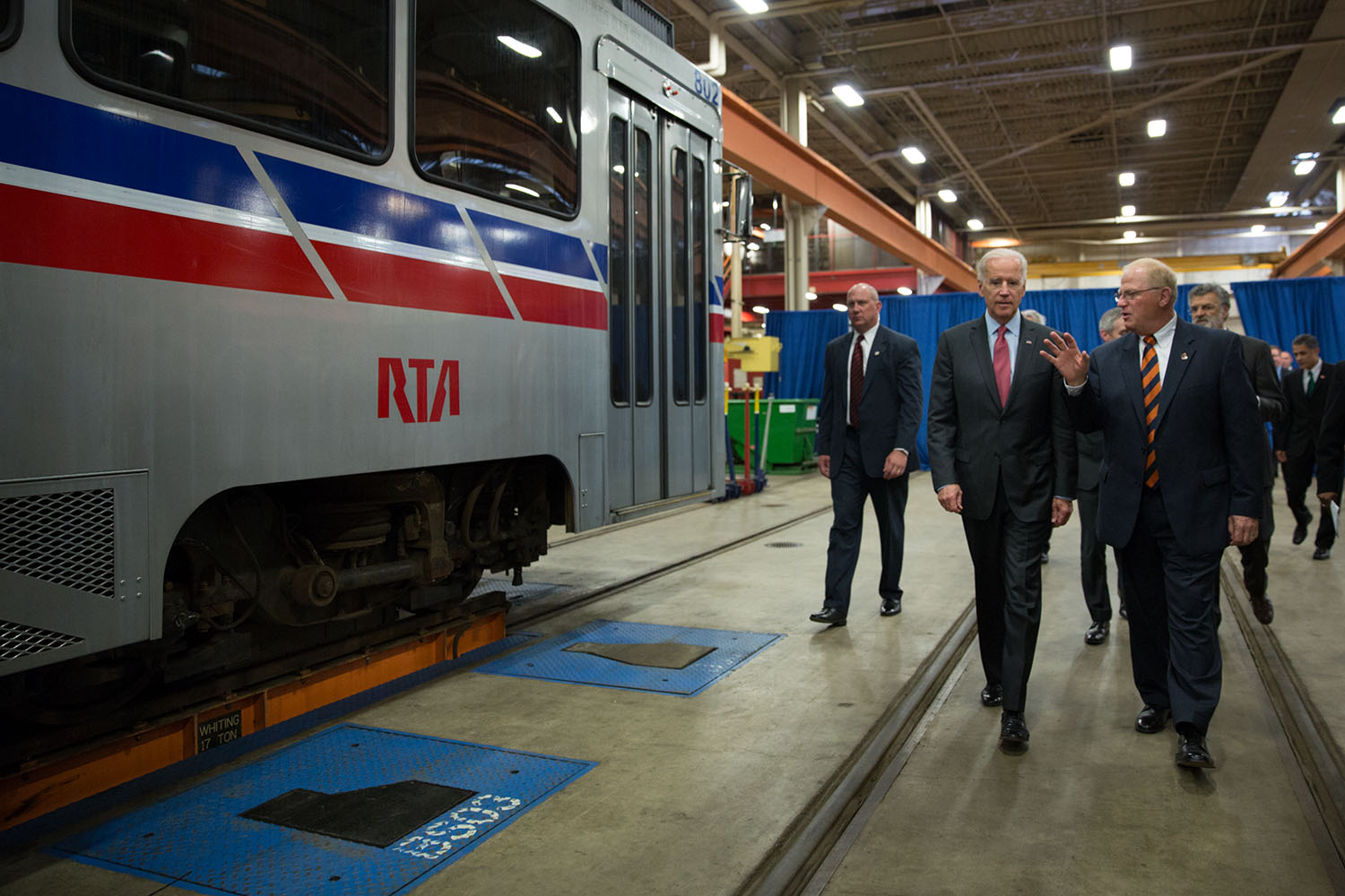 Vice President Joe Biden talks with Joe Calabrese, CEO and General Manager of the Greater Cleveland Regional Transit Authority, at their maintenance facility, in Cleveland, Ohio, May 14, 2014.