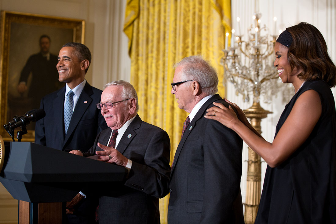 Jim Darby and Patrick Bova introduce President Barack Obama, with First Lady Michelle Obama, during the LGBT Pride Month reception in the East Room of the White House, June 30, 2014.