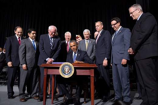 President Barack Obama signs H.R. 3230, the Veterans' Access, Choice, and Accountability Act of 2014