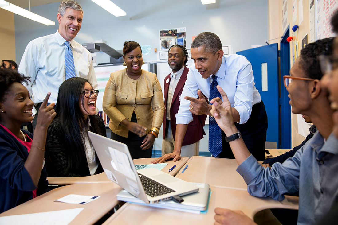 President Barack Obama and Education Secretary Arne Duncan talk with students while visiting a classroom at the Pathways in Technology Early College High School (P-TECH)