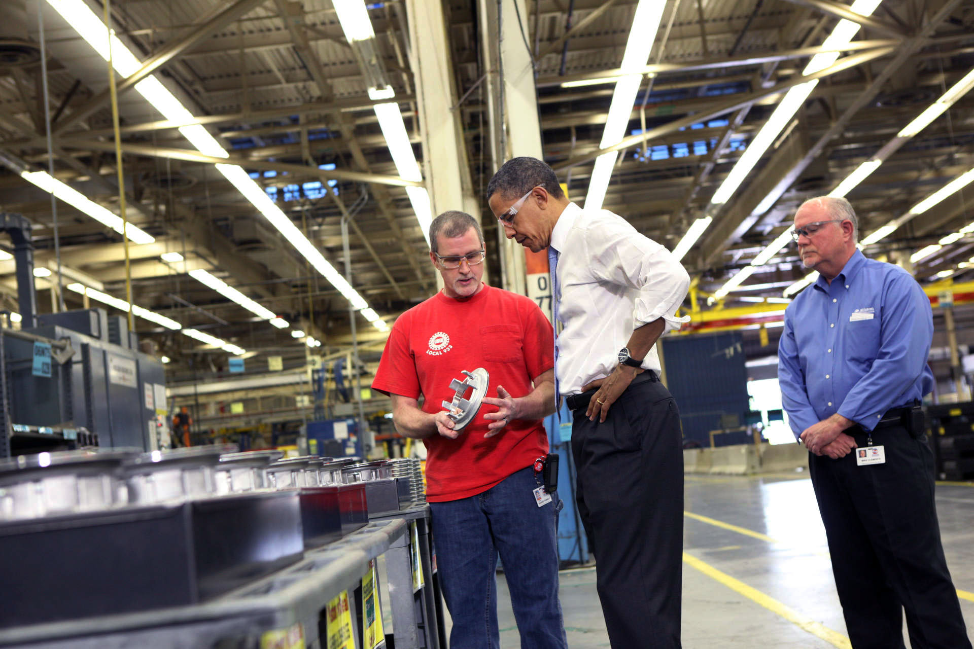 President Barack Obama Examines a Part During a Tour of Allison Transmission in Indianapolis, Indiana