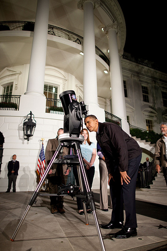 President Obama looks through a telescope during the 2009 White House Astronomy Night.