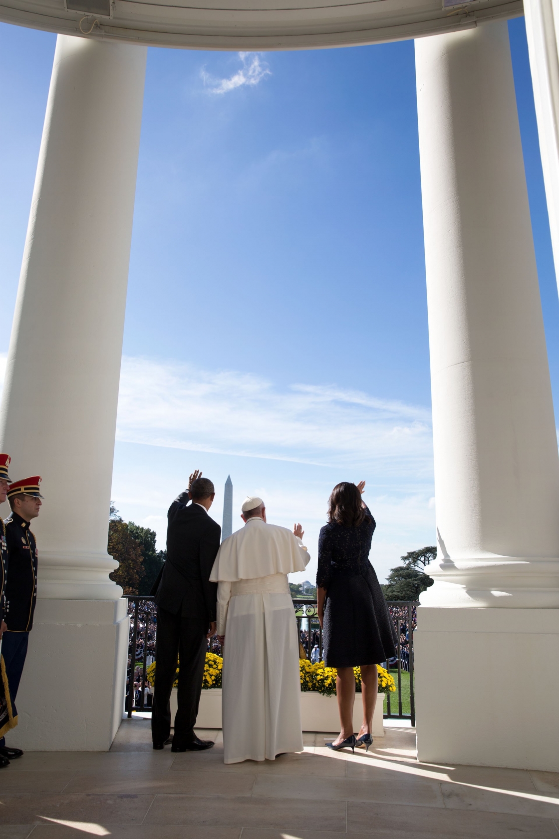 The Pope waves from the Blue Room Balcony with the President and First Lady. (Official White House Photo by Pete Souza)