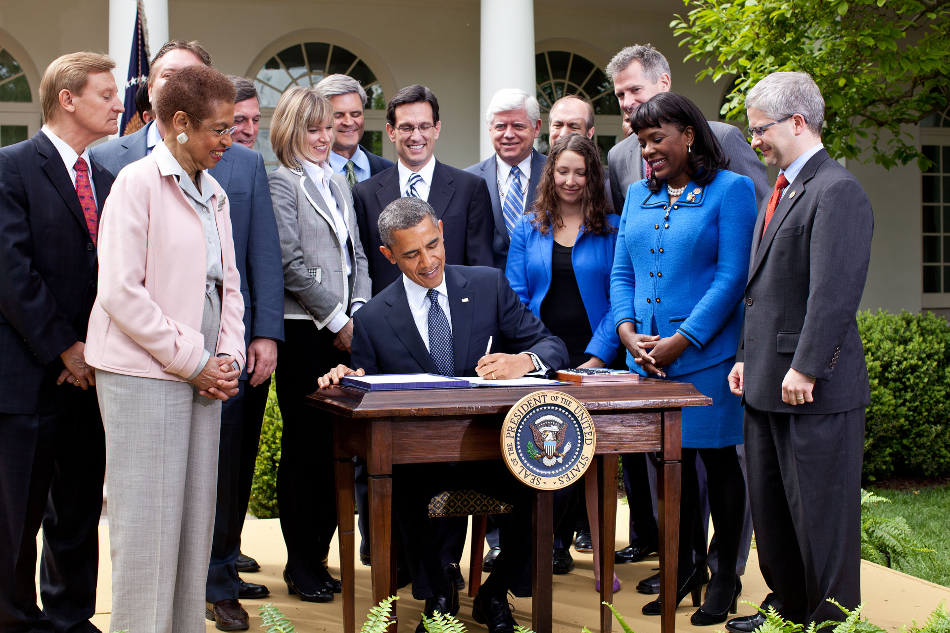 President Barack Obama signs the Jumpstart Our Business Startups (JOBS) Act in 2012.