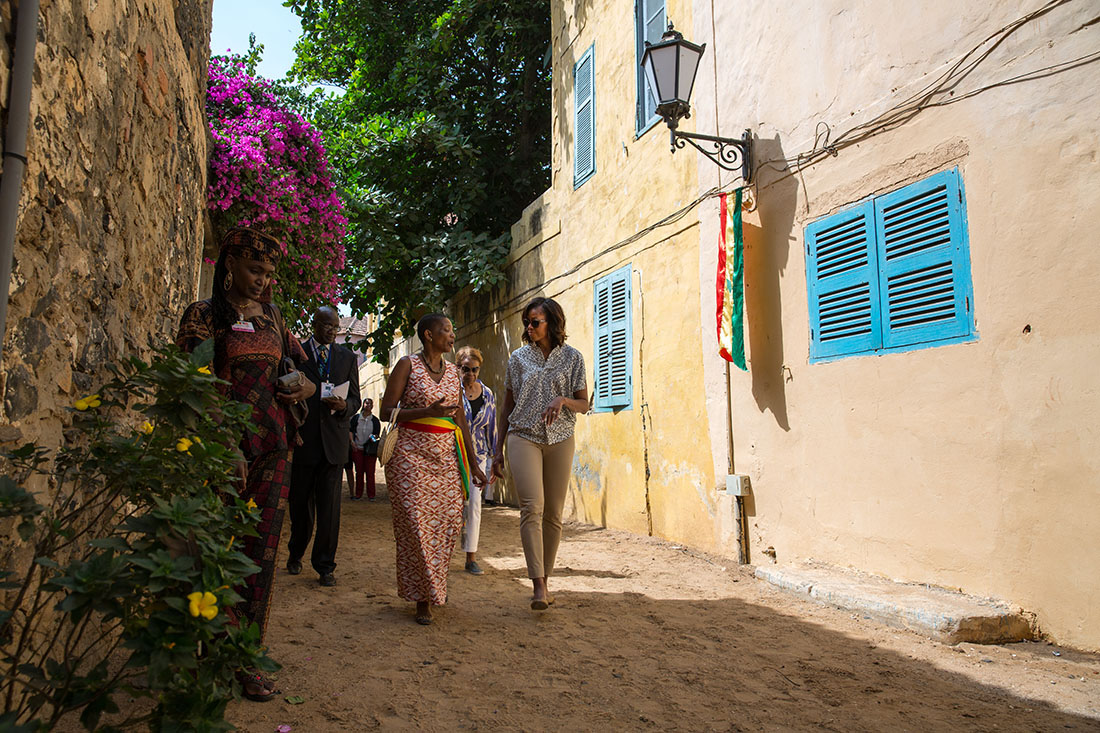 First Lady Michelle Obama walks from the Maison des Esclaves Museum 