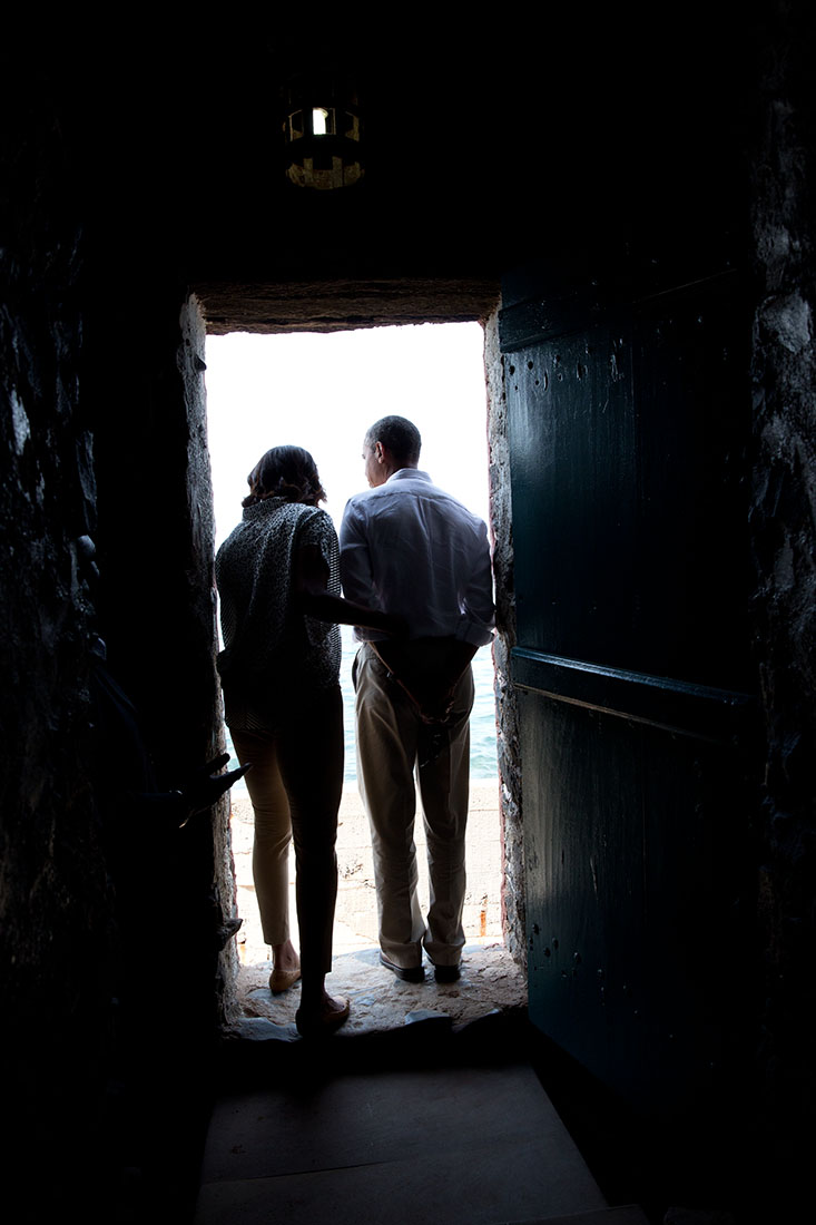 President Barack Obama and First Lady Michelle Obama stand in the 'Door of No Return' 