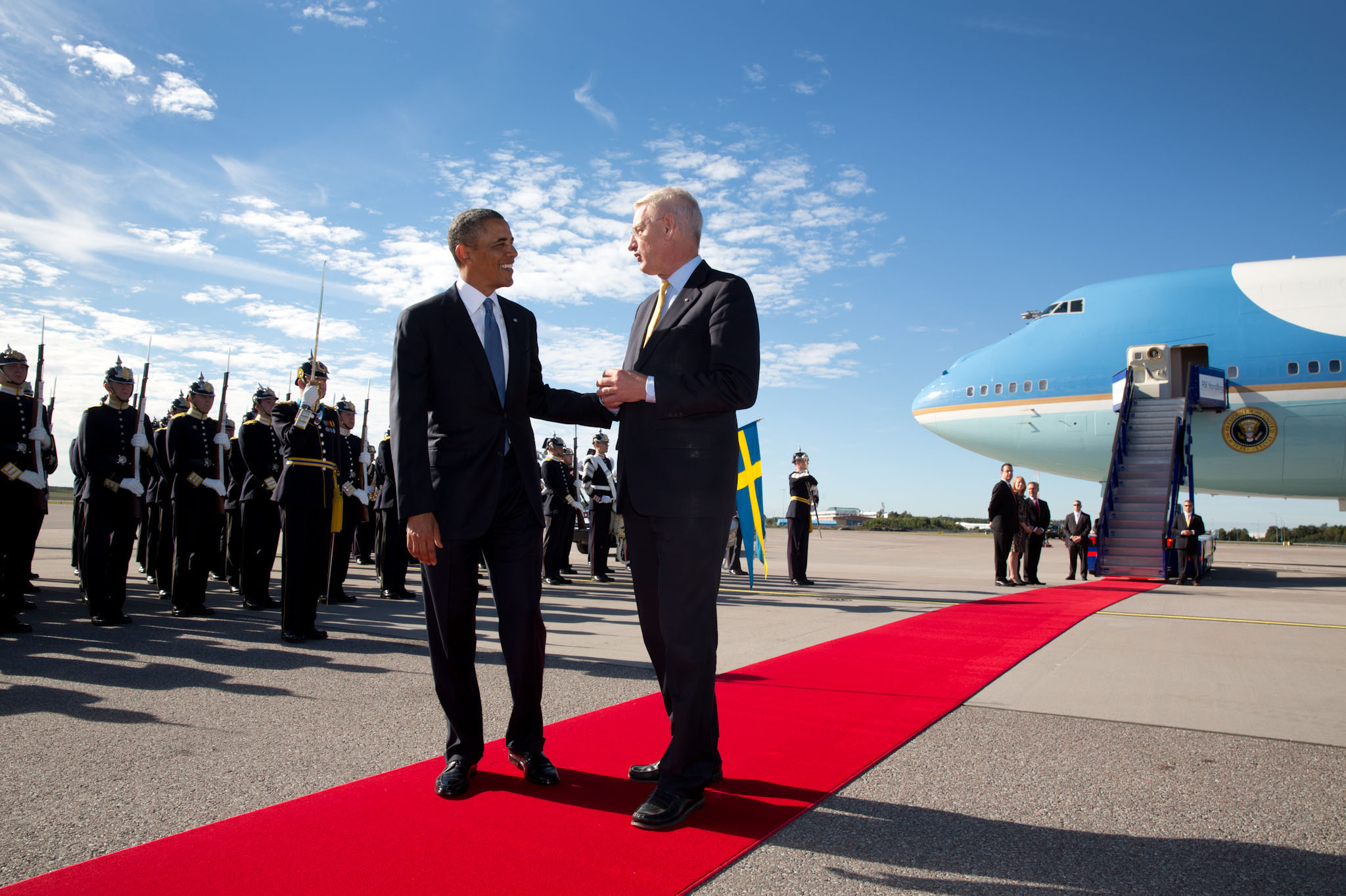 President Barack Obama talks with Foreign Minister Carl Bildt of Sweden during the arrival ceremony at Stockholm-Arlanda International Airport in Sweden