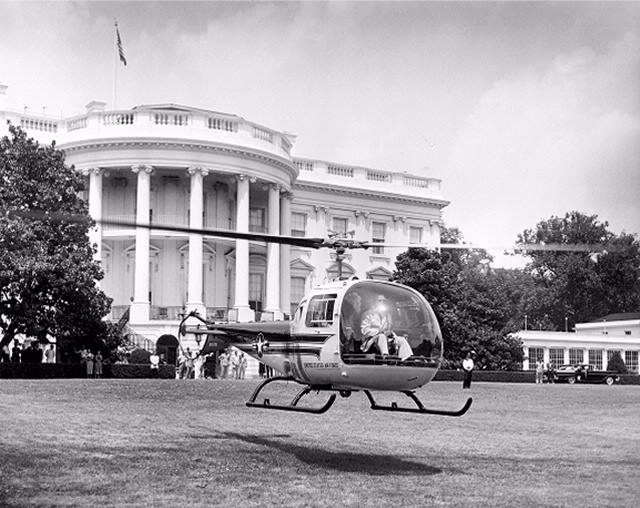 President Eisenhower departs the White House on July 15, 1957 in a two-passenger Bell H-13J helicopter.