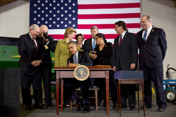 President Barack Obama signs the Farm Bill at Michigan State University in East Lansing, Michigan