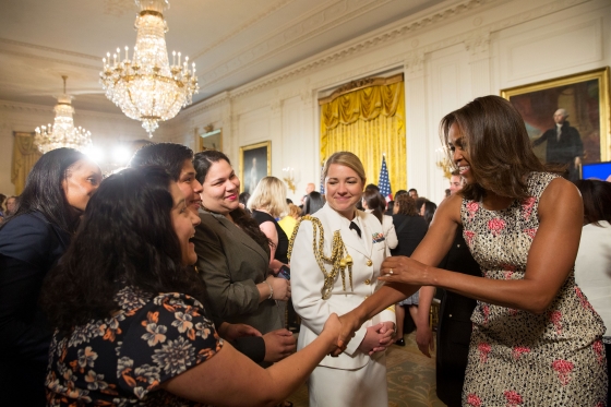 First Lady Michelle Obama greets guests after a discussion with panelists during the 2015 Beating the Odds Summit
