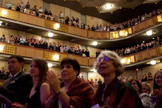 Members of the audience applaud during the Concert for Hope
