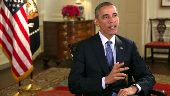 President Barack Obama tapes the Weekly Address in the Map Room of the White House, Dec. 5, 2014