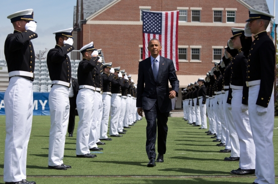 President Obama walks through an honor cordon