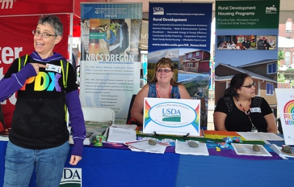A USDA alumna (left), who attended the Northwest Pride Festival with her partner and their two children