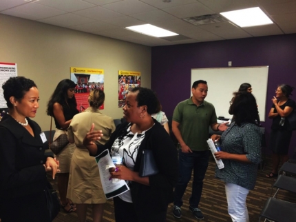 Community members engaging with federal representatives at the Initiative’s community roundtable on July 25, 2015
