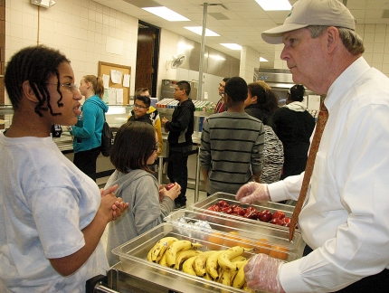Agriculture Secretary Tom Vilsack serves Des Moines, IA McCombs Middle School student Miracle Kizer