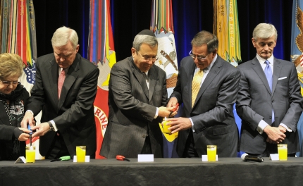 Secretary Panetta and Israeli Defense Minister Barak Light a Candle at Holocaust Remembrance Ceremony