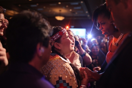 First Lady Michelle Obama greets the crowd after making remarks at the Women's Summit