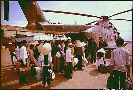 South Vietnamese villagers board a CH-3C helicopter, 1966