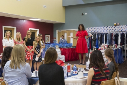 First Lady Michelle Obama surprises a baby shower in Italy