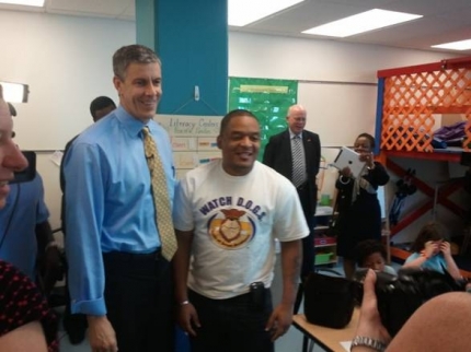 Secretary Arne Duncan visits with a Watch D.O.G.S. dad