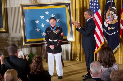 President Barack Obama leads an ovation for Corporal William "Kyle" Carpenter, U.S. Marine Corps (Ret.)