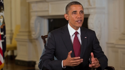 President Barack Obama tapes the Weekly Address in the State Dining Room of the White House Aug. 9, 2013.