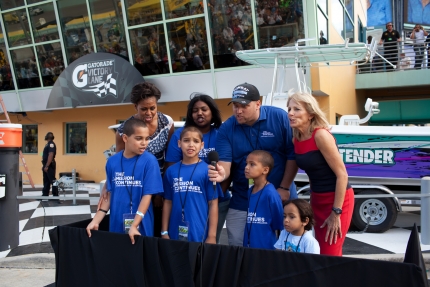 First Lady Michelle Obama, Dr Jill Biden and military family at NASCAR event