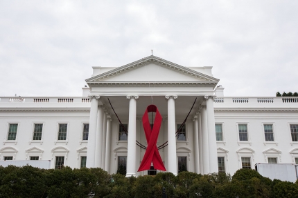 A red ribbon hangs from the North Portico of the White House on Dec. 2, 2013 to mark World AIDS Day