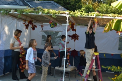 After the sukkah was built, a group of Jewish children with disabilities from local area schools, joined by their parents, came to decorate the sukkah. . . 