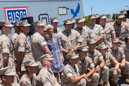 Dr. Jill Biden takes a photo with a group of Marines at Kadena Air Base