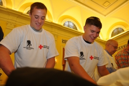 Volunteers putting together Transitional Care Packages