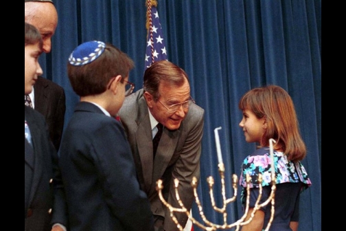 George Bush participates in a Hanukkah Celebration in the Old Executive Office Building on December 21, 1989. 