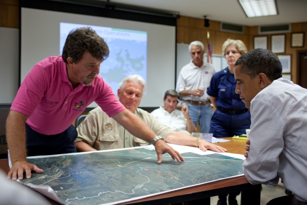 Grand Isle (Louisiana) Mayor David Camardelle points out areas on a map