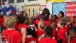 The First Lady And Rachael Ray Hug Students