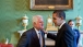 President Barack Obama talks alone with Sen. Edward Kennedy