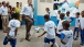 The President plays soccer with children