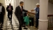 President Barack Obama fist-bumps custodian