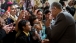 President Obama smells a rose given to him by Sophia Ahmadi