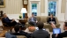 President Obama Meets with Staff in the Oval Office
