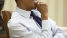 President Obama Smiles During a Meeting with His Senior Advisors