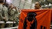 President Barack Obama Holds a Banner